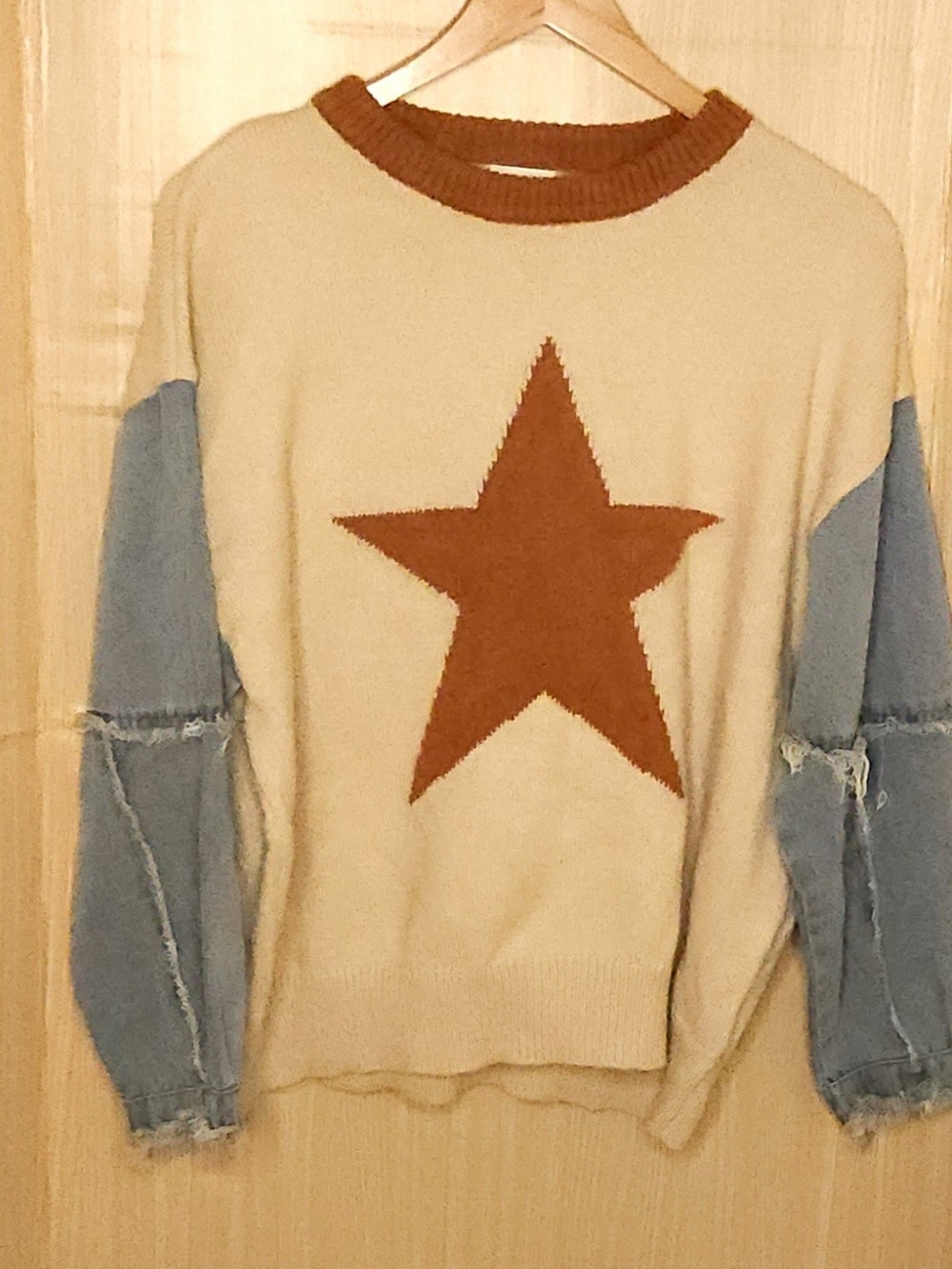 Bibi women’s oversized star sweater with denim sleeves large.
